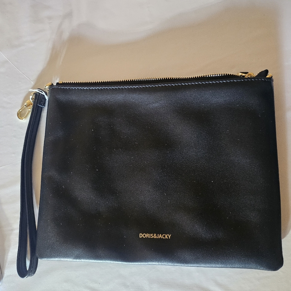 Doris & Jacky Black leather clutch bag with gold hardware.NWOT